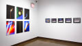On the left are six abstract and strikingly colored images printed on panels. To their right are five night landscape images, each in its own black frame.