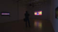 Multiple views of SVA Flatiron Gallery. There are three monitors playing various videos on the wall and an interactive projection. 