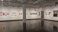 Multiple views of SVA Chelsea Gallery. There is illustrations and paintings hung on the walls. There are multiple shelves throughout the gallery with books places on them.