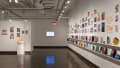 Multiple views of SVA Chelsea Gallery. There is illustrations and paintings hung on the walls. There are multiple shelves throughout the gallery with books places on them.