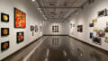 Multiple views of SVA Chelsea Gallery. There are photographs hung on the wall, installations and projections throughout the gallery. 