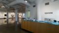 Multiple views of SVA Chelsea Gallery. There are photographs hung on the wall, installations and projections throughout the gallery. 