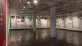 Multiple views of SVA Chelsea Gallery. Posters are hung on the walls. The second gallery has two projections on opposite walls with chairs in the center. 
