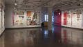 Multiple views of SVA Chelsea Gallery. Posters are hung on the walls. The second gallery has two projections on opposite walls with chairs in the center. 