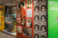Photos of Wilde as a child and of his parents cover a red wall along the boardwalk. A jukebox sits next to them.