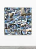 Camera roll of images of a blue and white scarf presented in a grid on a wall.