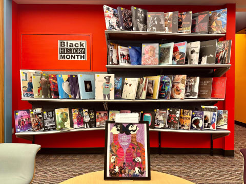 Library display for Black History Month. Several books in shelved organized with their covers on display. 