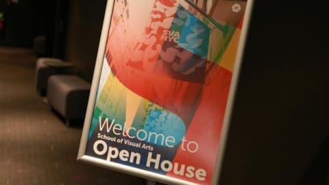 A colorful sign Welcoming guests to an Open House