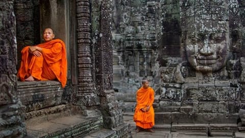 Buddhist Monks at Ta Prohm Temple in the Angkor Complex (Cambodia)