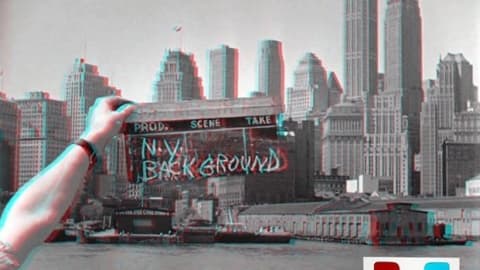 An artwork of the landscape of a city with a person's arm holding a production set sign, saying "N.Y. Background." The image is blurry and in the right hand corner a 3-D glasses symbol is present.