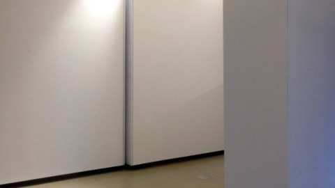 Movable walls creating a hallway.