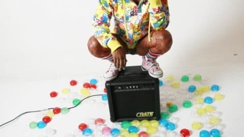 woman standing on sound box with bubbles