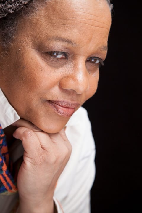 A photo of Michele Washington resting her chin on her hand