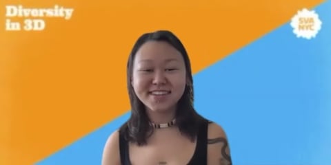 A screenshot of a person with long dark hair and a beaded choker necklace speaking against a blue and orange diagonally split background