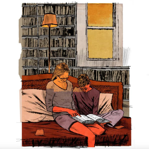 An illustration of a woman and a young boy looking at a book while sitting on a couch in a room where the walls are lined with bookshelves 
