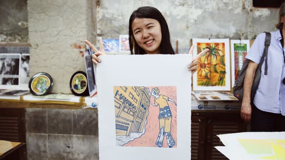 Student holding print from the Printmaking in Havana, Cuba program.