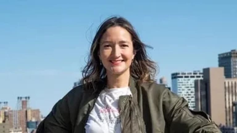 Photograph of the scholar Eva Diaz standing on the roof.