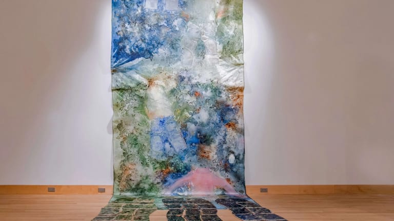 Colorful installation that cascades down to the floor made of acrylic and mixed media.