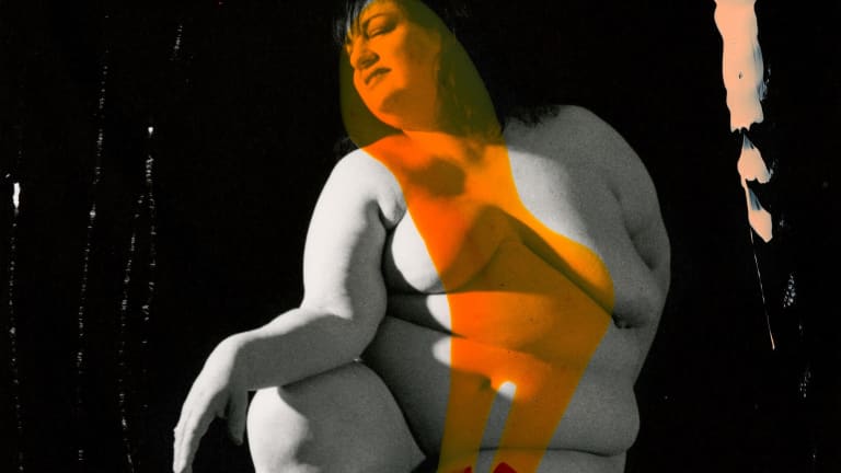 Black and white photograph of a nude with large gestural brushstroke of orange an another of red at bottom