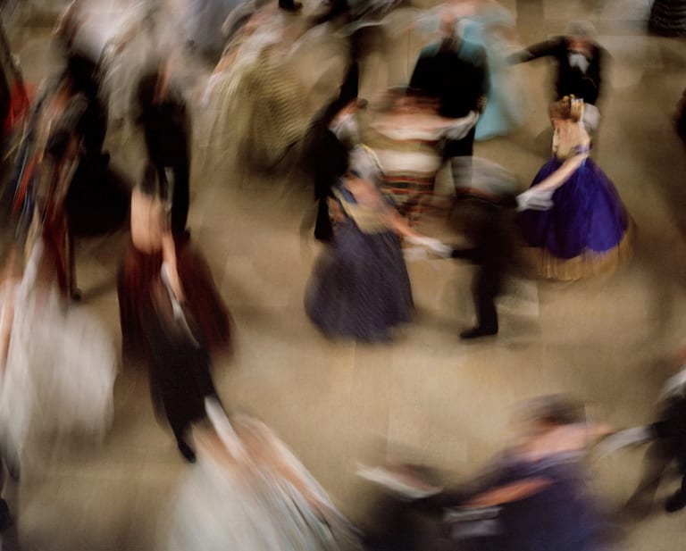 A painting of a blurred birds eye view of people dancing together