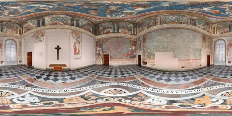 A panoramic view of a religious building with Christian paintings and icons with Latin tile inscriptions.