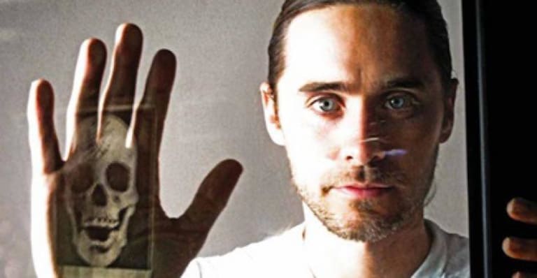 Jared leto with skull image reflected on hand