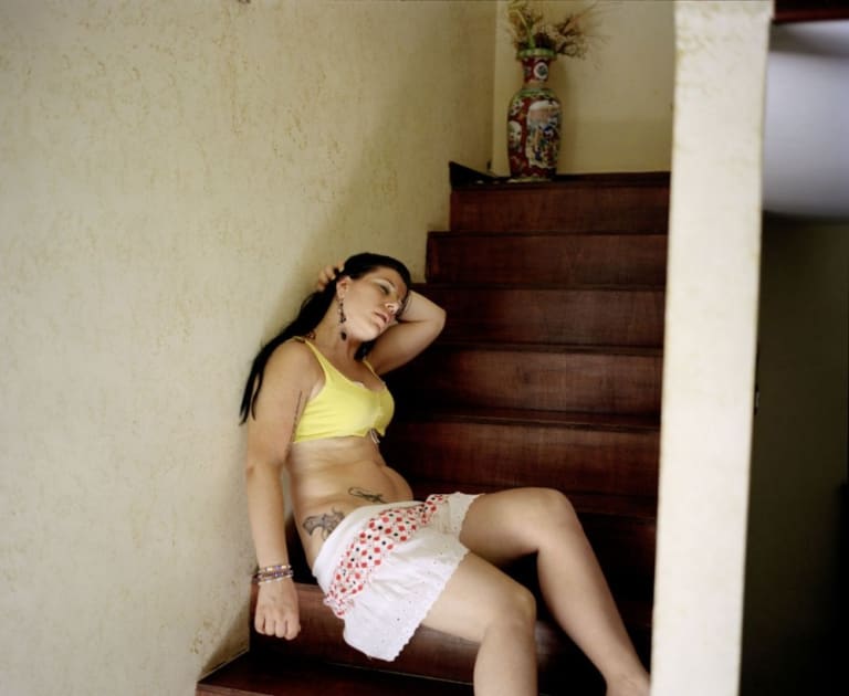 A girl sleeping in a steps