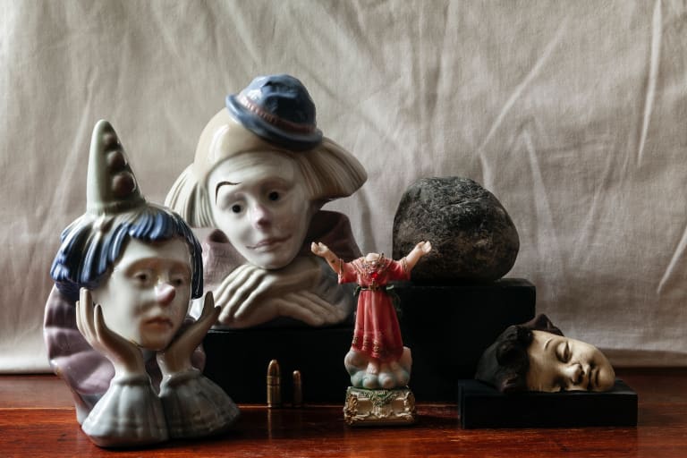 A photograph of ceramic figures on a table