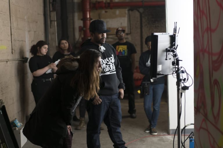 2 directors, one male and one female, in action behind the scenes of a film