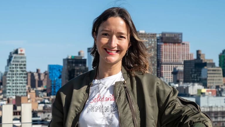 Photograph of the scholar Eva Diaz standing on the roof.