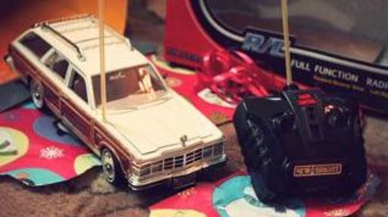 A newly unwrapped Christmas Gift of an RC Station Wagon with hand held controller.