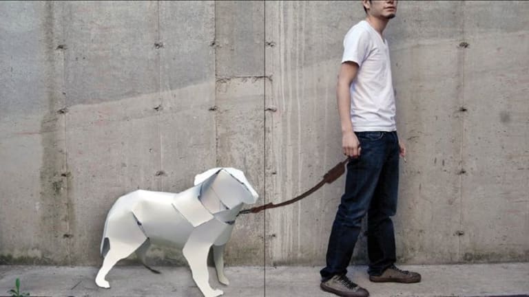 Man in white T-shirt with a white paper dog on a leash