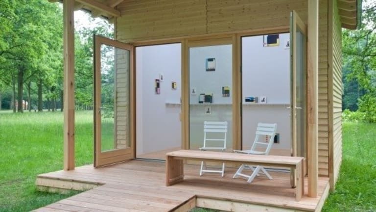 Outdoor office and shed with a porch.