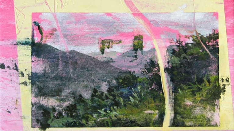 a blurred landscape with some vibrant pink accents added