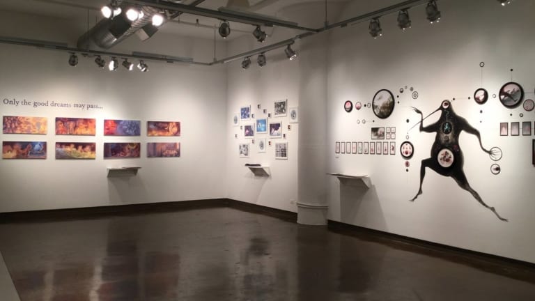 Artwork displayed on the wall of a gallery.