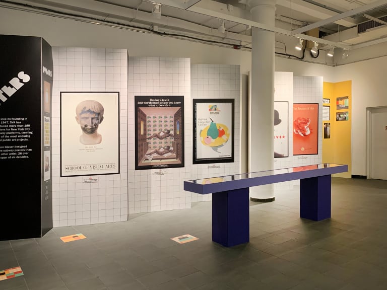 Exhibition view of 5 Milton Glaser NYC subway posters mounted on a wall