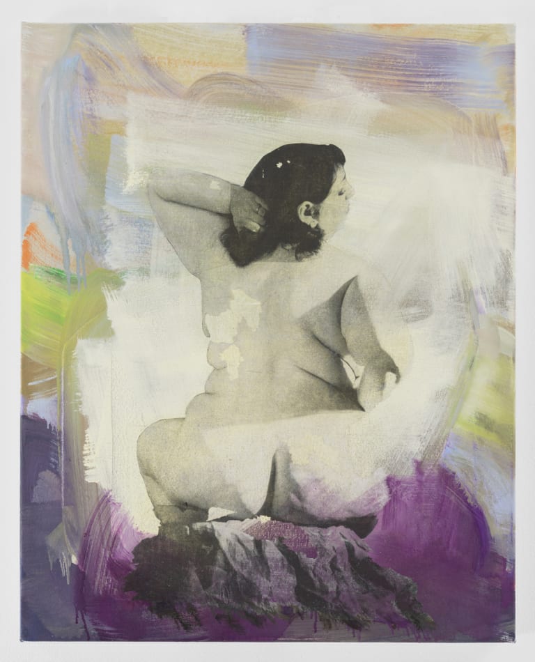 Yellow and purple paint applied around the sides and bottom of a black and white photo of a nude woman seated with her facing the viewer.