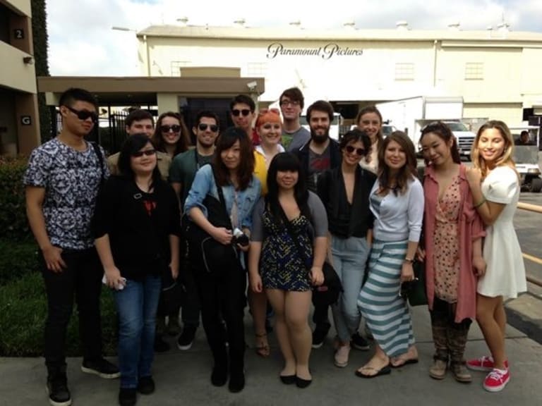 a group of people smiling in the camera