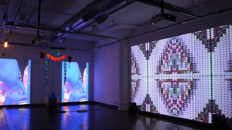 Image of a projector displaying digital artowork
