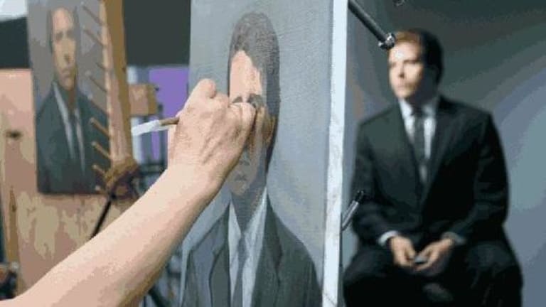 A man in a dark suit getting a portrait painted.