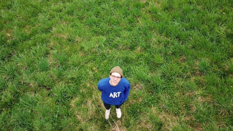 photo of Andrew Herzog taken from above in a grassy area