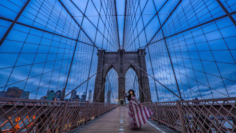 person posing on brooklyn bridge