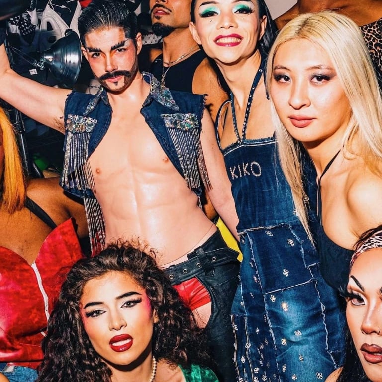 Portrait of a group of people dressed up at an LGBT rave. 