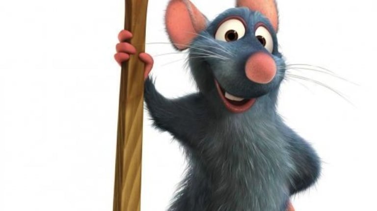 Remy the Rat from Ratatouille poses with a spoon