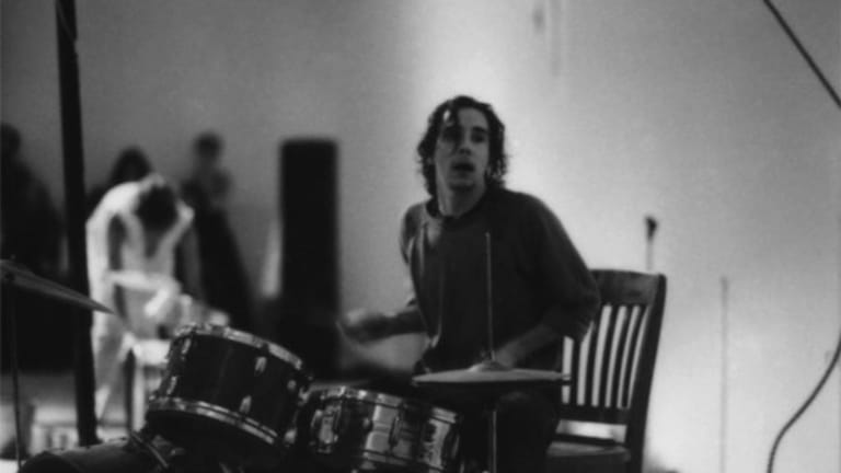 Out of focus black and white action shot of drummer