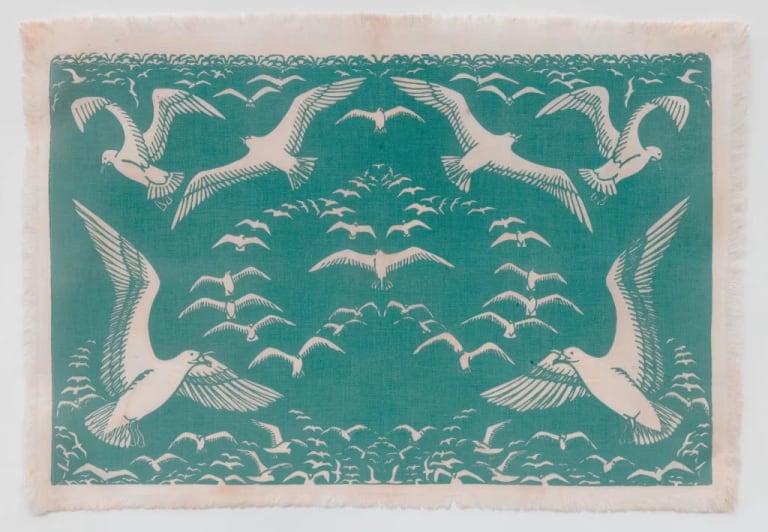 Light blue print of sea gulls in an upside-down heart formation.