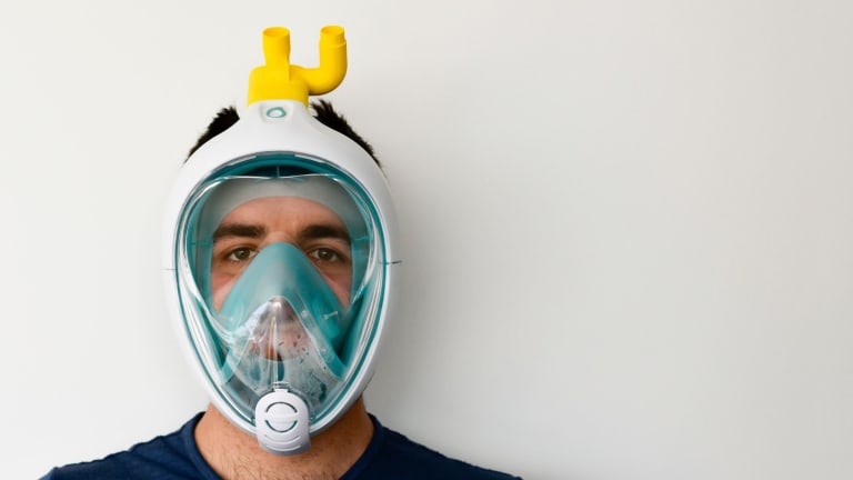 Here is a photo of a man wearing a breathing apparatus.