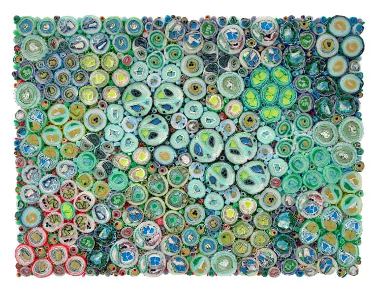 Image showing a rectangular canvas made of rolled plastic materials and cut straws, together forming a tapestry of circles of varying sizes.