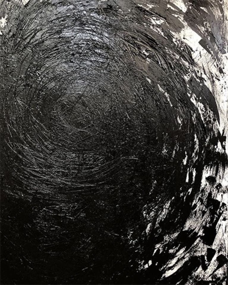 black and white image of what looks almost like a galaxy in space carved of stone