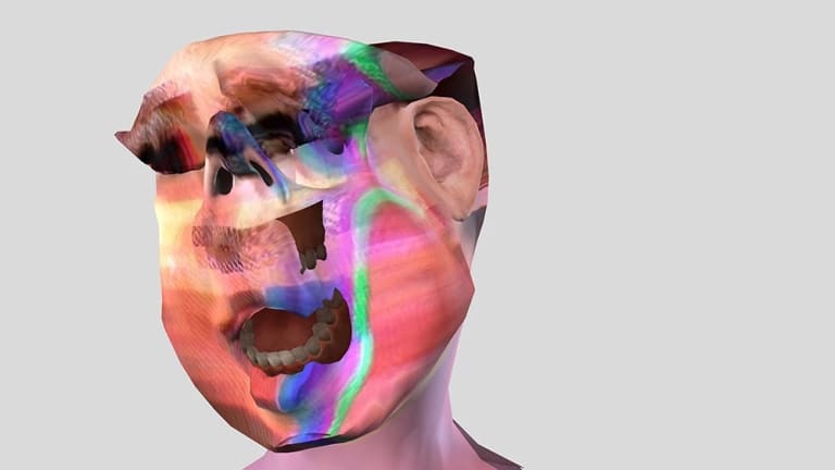 Image of a computer generated face distorted with various colors and glitchy forms
